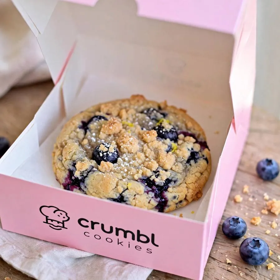 Blueberry Muffin Crumbl Cookie served in a pink bakery box