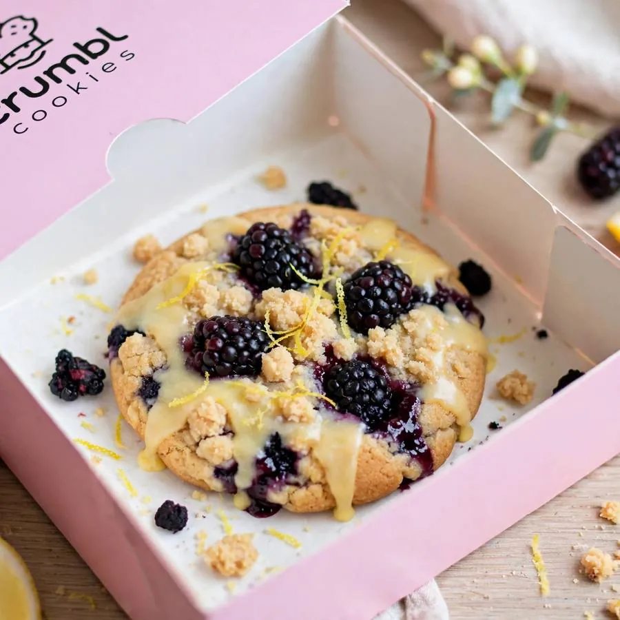 Lemon Blackberry Cake Crumbl in a pink bakery box