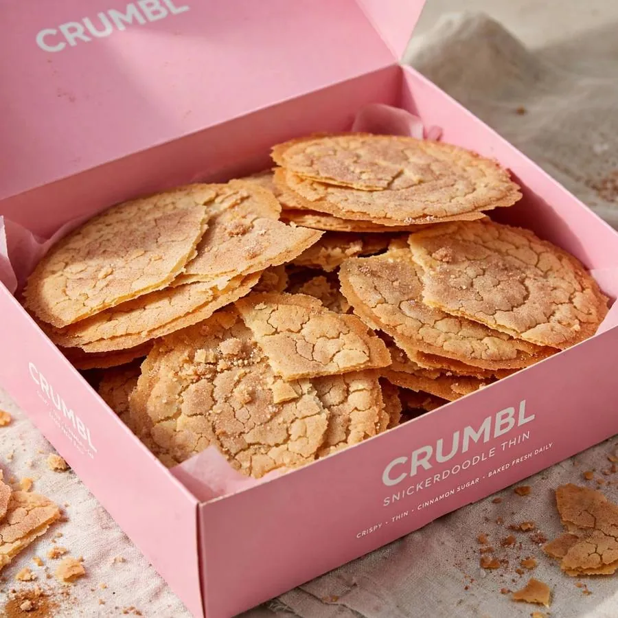 Snickerdoodle Crumbl Cookie Thins in a pink bakery box Snickerdoodle Crumbl Cookie Thins in a pink bakery box